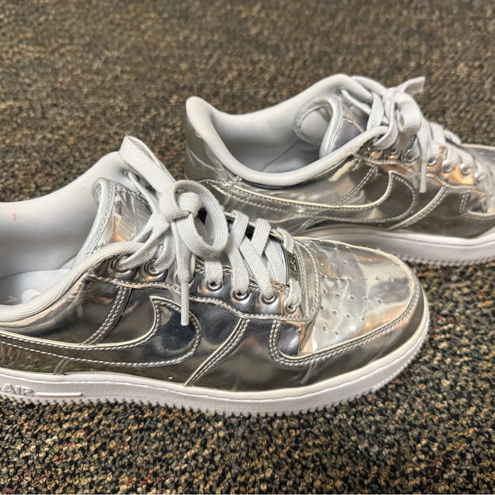 Nike chrome Shimmering Silver Low-Tops purchased from revolve